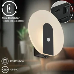 LED-akku-seinävalaisin Taro, musta matta, Ø 15 cm, anturi
