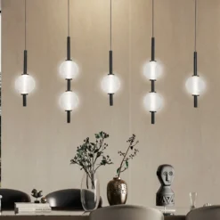 LED-riippuvalaisin Abeona, pituus 105 cm, musta metalli, 7-lamppuinen.