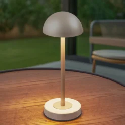 Lindby LED-akku-pöytälamppu Pippin, kulta/travertiini, IP44