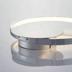 Lindby LED-seinävalaisin Anays, Ø 32 cm, kromi/kirkas, muovia