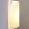 Lindby LED-seinävalaisin Helmi, korkeus 21 cm, lasi, puoliympyrän muotoinen