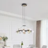 Lucande LED-riippuvalaisin Pallo, 12-lamppuinen, musta/kulta, lasi