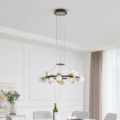 Lucande LED-riippuvalaisin Pallo, 12-lamppuinen, musta/kulta, lasi