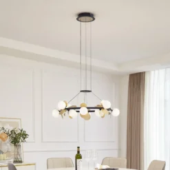 Lucande LED-riippuvalaisin Pallo, 12-lamppuinen, musta/kulta, lasi